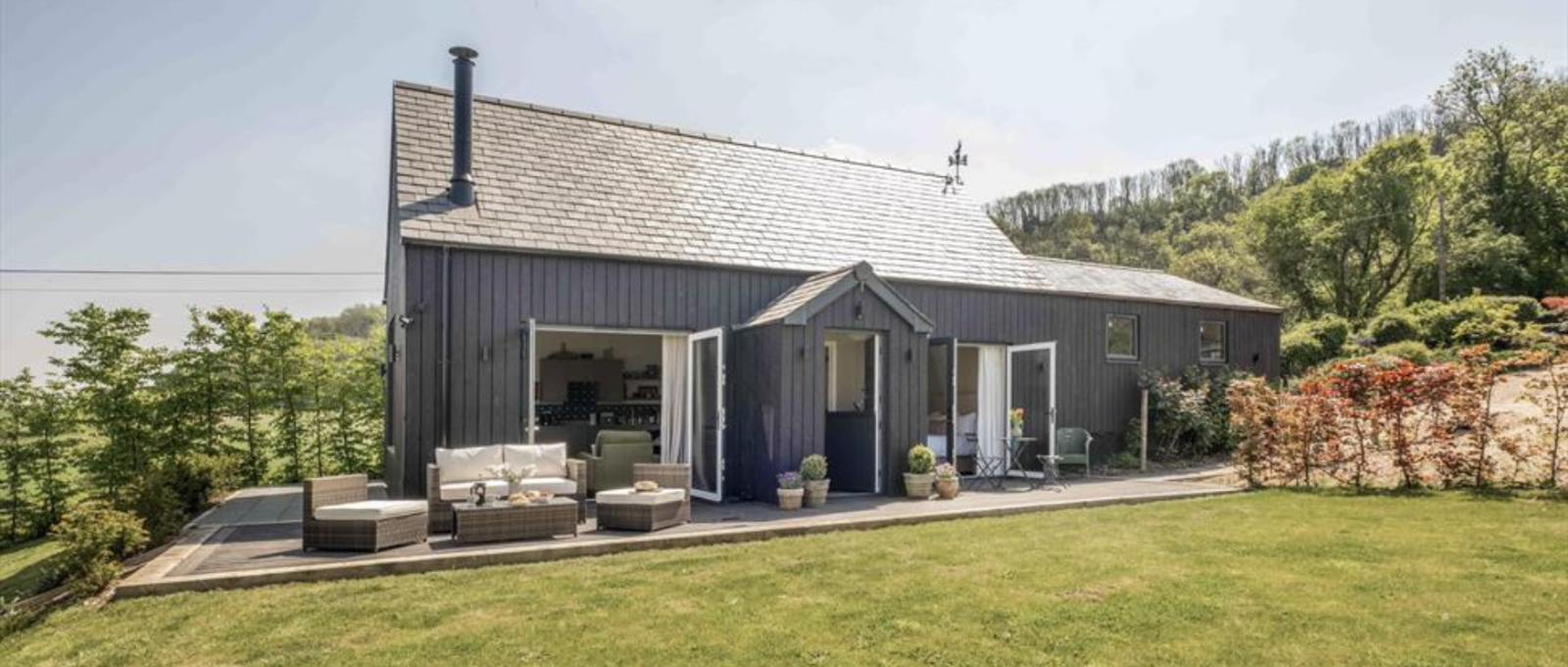 The exterior and gardens of Beacon Hill Barn
